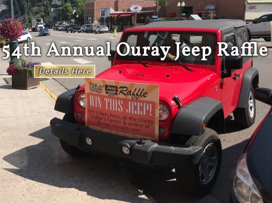 Ouray Chamber Resort Association 10-06-2018 raffle - 2018 Jeep Wrangler - left front with sign 