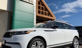 Messner Foundation 6-08-2019 raffle - 2019 Range Rover Velar P250 S - left front with bldg