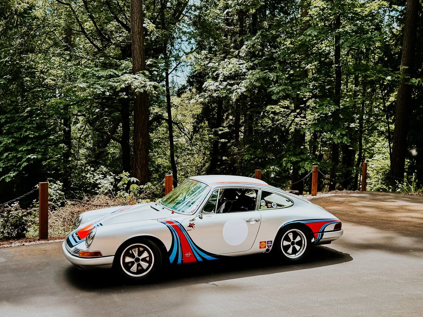 1967 Porsche 911S on a wooded road